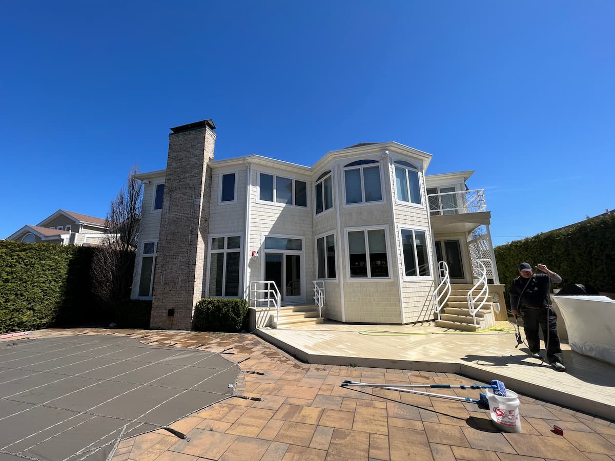 Kevin on a paver sealing job at a South Shore Merrick NY pool deck — Pressure Wash Long Island owner with over 40 years experience on Long Island properties