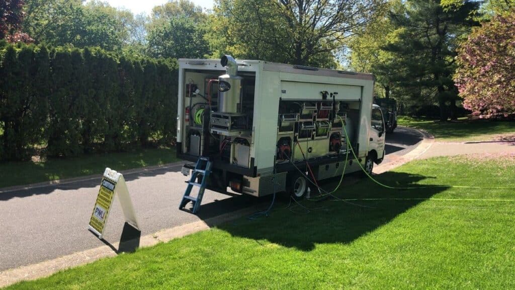 Pressure Wash Long Island truck and equipment set up on a North Shore Nassau County property — power washing Oyster Bay NY